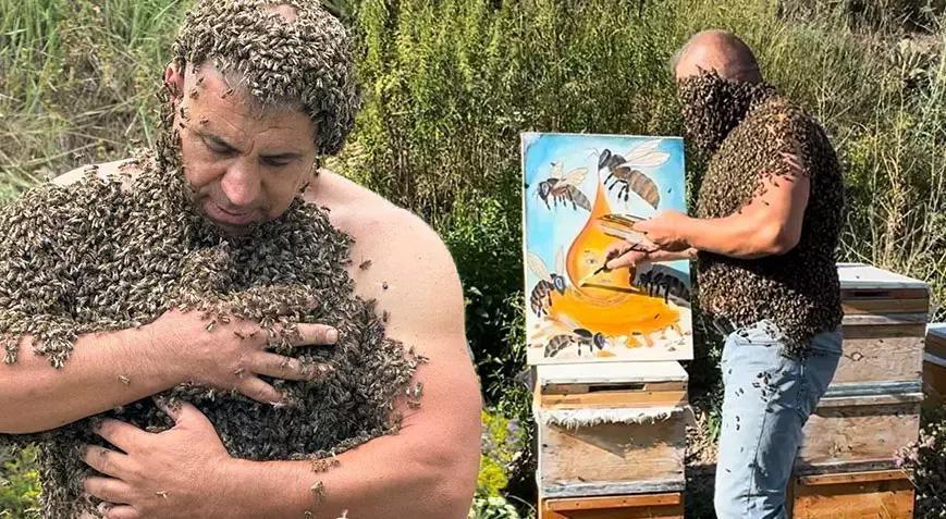 ‘Arı adam’ sınırları zorladı! Vücudunda binlerce arıyla resim yaptı