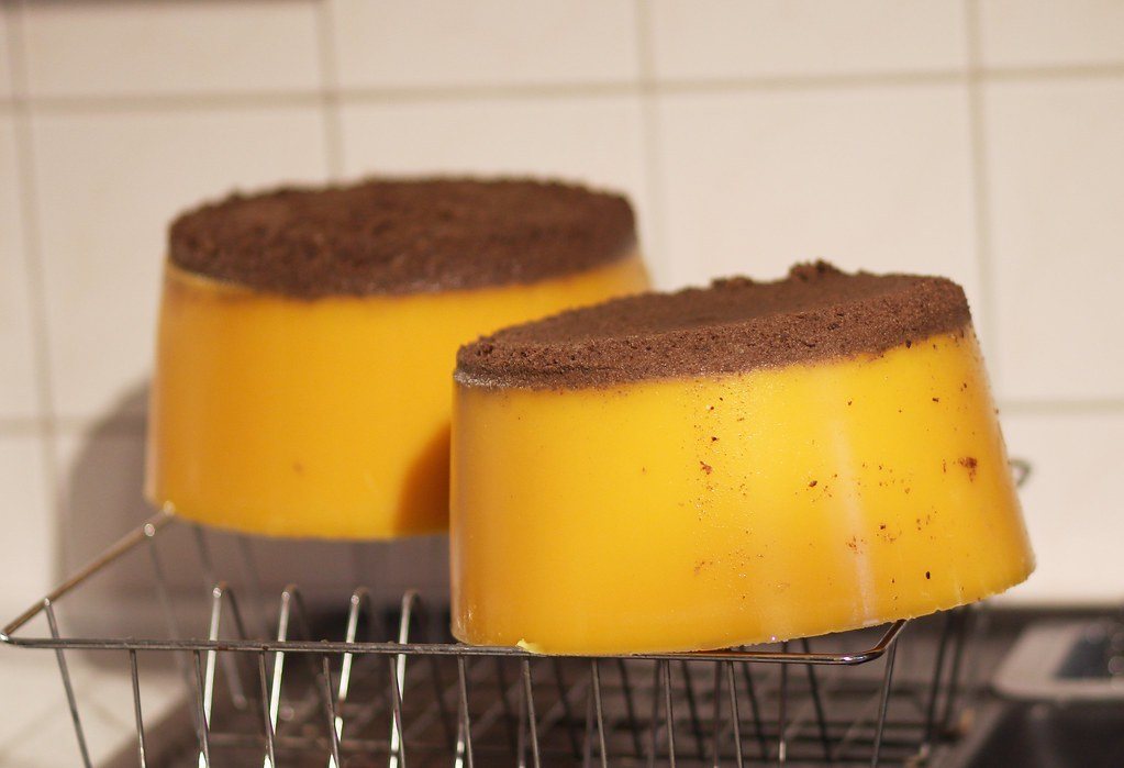 Beeswax blocks taken out of a mould with the bottom layer of dirt