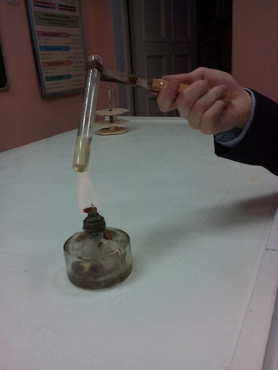 Heating a sample in a test tube over a spirit lamp