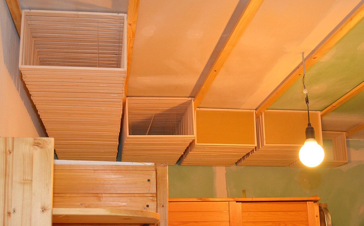 Empty frames stored on bars hung from the ceiling